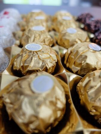 Charleroi, Belgium - December 28 2019: Ferrero Rocher chocolate pralines with hazelnut