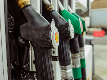 Rodange, Luxembourg - December 10 2019: Jet nozzles or hoses with tap for dispensing fuel at a gas stationのeditorial素材
