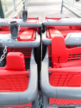 Shopping trolleys outside the supermarket Auchan