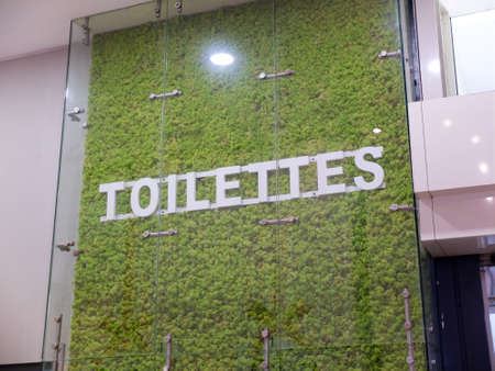 French toilets text sign with a nature and grass touch