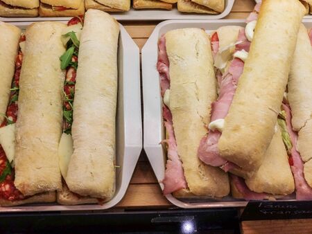 Assortment of paninis / sandwiches ready for cookingの写真素材