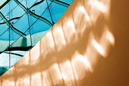 Abstract art in architecture, this detailed image shows how glass and steel combine wonderfully with...