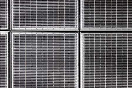 This abstract stainless steel grid forms a wonderful industrial graphic art compositionの写真素材