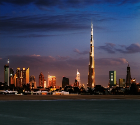 Dubai skyline at dusk seen from the Gulf Coast, shows the Sky Scrapers of the Sheikh Zayed Roadの写真素材