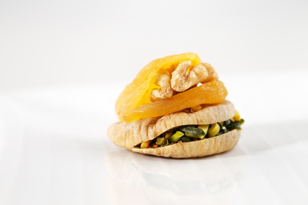 Dried Apricots stuffed with walnuts and dried figs stuffed with sliced pistachios are a popular delicacy in the Middle East particularly Saudi Arabiaの写真素材