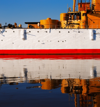 The USS Olympia stands reflective and graceful in the still waters of Penns Landing, City of Philadelphiaのeditorial素材