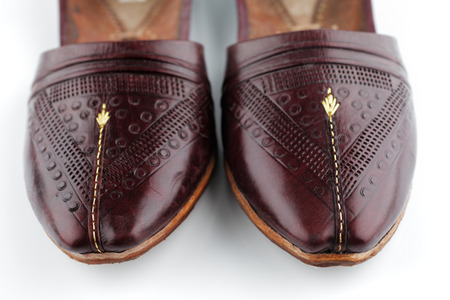 Traditional Arabic slippers shot against a white backgroundの写真素材