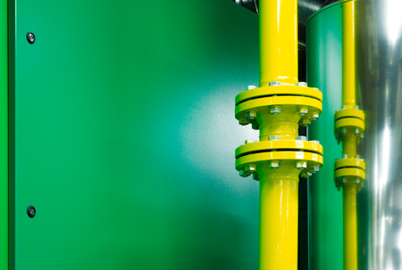 Plant room mechanical systems showing high pressure pipes bolted together using a flange system for added safetyの写真素材