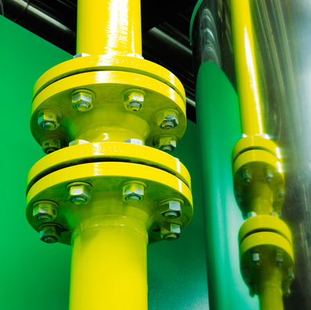 Plant room mechanical systems showing high pressure pipes bolted together using a flange system for...