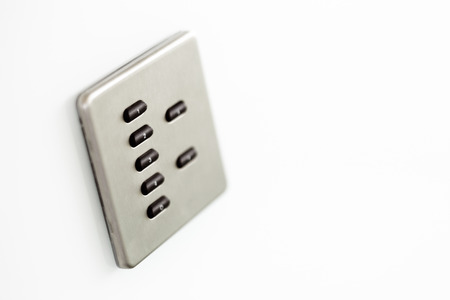 A sophisticated control switch for lighting in a conference room which has a number of preprogrammed levelsの写真素材