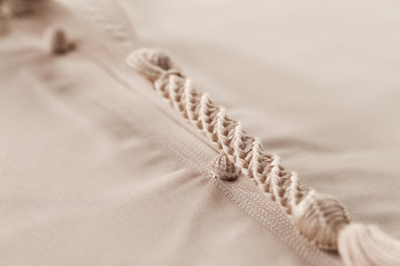 An abstract detail of a Tarboosh which is an Arabic style  tassel like  tie that is usually worn with a thawb or kandura in Arabia の写真素材