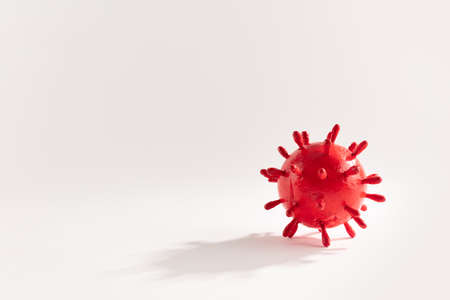 A photograph of a large red virus sculpture. The artwork inspired by the Covid-19 lockdown of 2020の写真素材