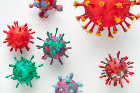 A photograph of a collection of six colorful 3D Virus artwork model forms. Inspired by the Covid-19 lockdown of 2020の写真素材