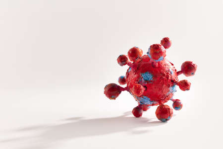A photograph of a colorful virus sculpture. The artwork inspired by the Covid-19 lockdown of 2020の写真素材