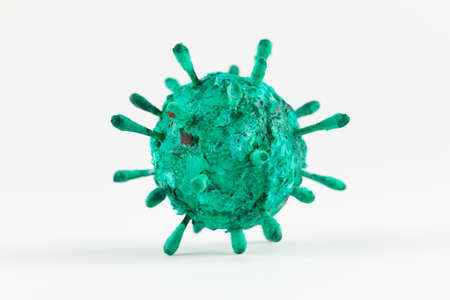 A photograph of a green virus sculpture. The artwork inspired by the Covid-19 lockdown of 2020の写真素材