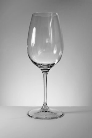 Empty wine glass on a white background, black and white photographyの写真素材