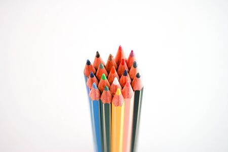 Color pencils isolated on white background close up. Art, hobbies, drawing and school toolsの写真素材