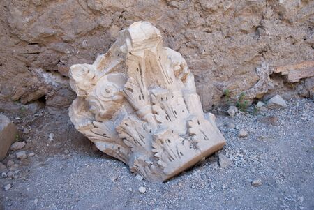Old broken and ancient ornamental stone on the floor at the Palatine hill in Romeの写真素材