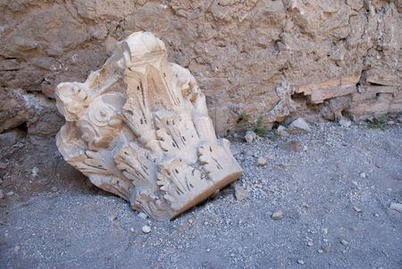 Old broken and ancient ornamental stone on the floor at the Palatine hill in Romeの写真素材