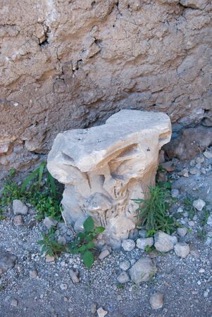 Old broken and ancient ornamental stone on the floor at the Palatine hill in Romeの写真素材