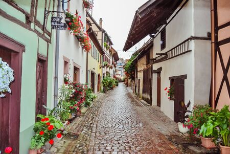 Pretty little flowery street with its traditional houses, in Alsaceのeditorial素材