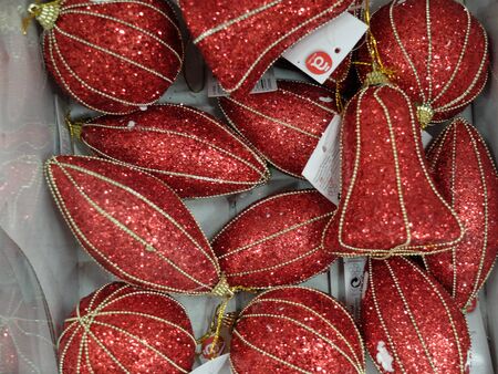 Mont-Saint-Martin, France - November 29 2019: Red and sparkling Christmas balls at shopping mall Auchanのeditorial素材