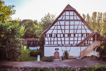 Ungersheim, France - July 21 2012: Ecomuseum of Alsace, the outdoor living museum, presentation of craftsmen and traditional houses of a villageのeditorial素材