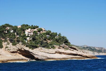 Beautiful view of the sea with mountain rocks with trees and beautiful villas houses in Provence, Marseilleの写真素材