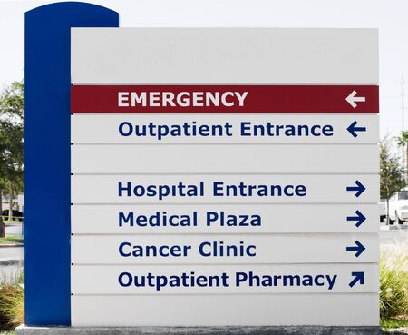 Hospital sign showin direction to different medical services
