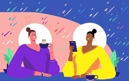 Two women gossip in a modern cafe. Chit chat.