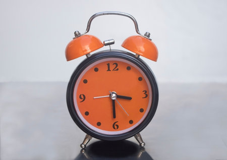 Retro style alarm clock brought to life with trendy vivid colors.の写真素材