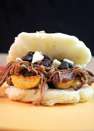 PabellÃ³n con arepas. Latin American cuisine - Colombia, Venezuela, Bolivia,.
Arepa is a type of food made of ground maize dough.の写真素材