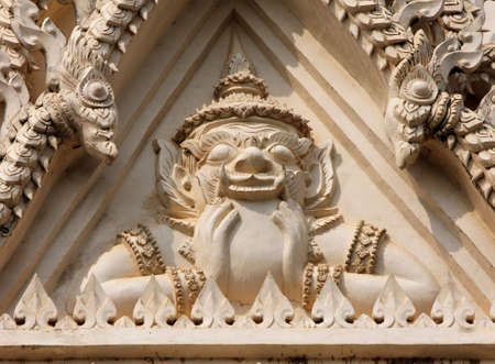 God Rahu at one of the temples in Thailand. Bas-relief made of sandstone.  In Hindu Astrology Rahu represents materialism, mischief, fear, insatisfaction, obsession and confusion.の写真素材