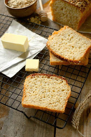 Super healthy oatmeal bread with butter and spread for bread. Rustic composition. French cuisine.