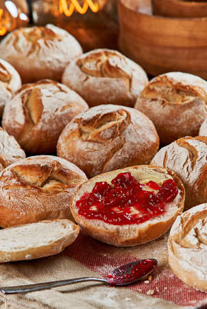 The Kaiser roll, also called a Vienna roll or a hard roll, is a typically crusty round bread roll, originally from Austria.  Austrian cuisine.の写真素材