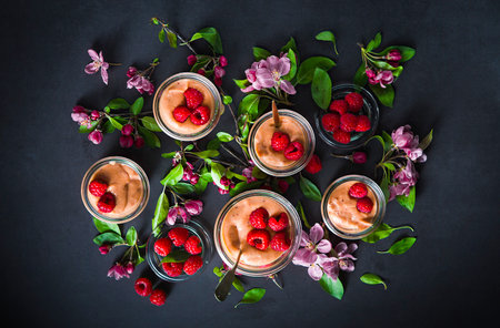 Velvety Cocoa and raspberry pudding with a hint of cinnamon served in a Mason Jar. Gourmet dessert. Spring composition. French cuisine.の写真素材