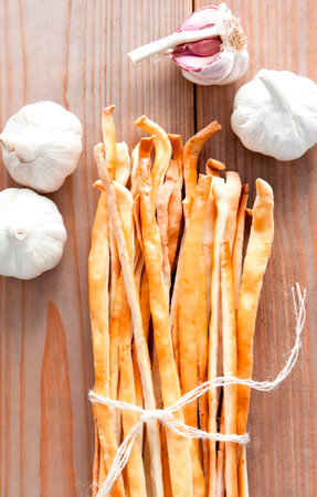 Breadsticks, also known as grissini, grissino or dipping sticks, are generally pencil-sized sticks...