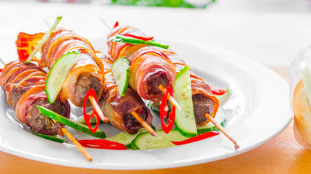 Bacon wrapped Kebab skewers. Ingredient for bacon-kebab sandwich. Gourmet meal.の写真素材