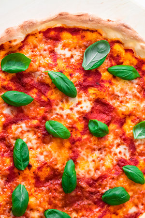 Pizza Margherita on a thin crust. Close-up, baked in a wood-fired pizza oven.  Italian cuisine. Gourmet meal.の写真素材