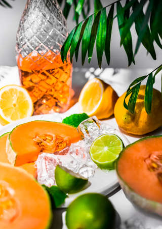 Iced Rockmelon (Cantaloupe) smoothie garnished with fresh herb. Vitamin bomb for vegetarians and more. Gourmet cocktail.の写真素材