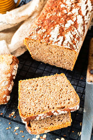 WHOLE GRAIN WHEAT-RYE BREAD with sourdough buttermilk. Rustic style, bakery concept. Bakery and...