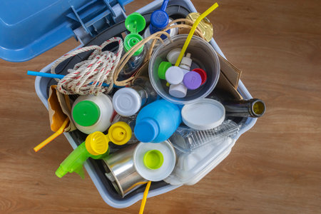 Home Recycling Bin with lid before sorting glass, plastic, paper, metal into separate recycling containers. Isolated on a brown background. Close-up.
Copy space.  Garbage recyclingの写真素材