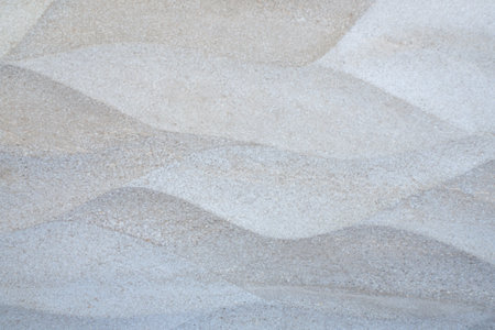 Light brown gray wave pattern tile wall, can use be background of wallpaper, closeup
