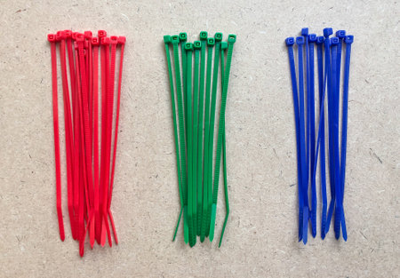 Cable ties, green, blue, red, on wooden backgroundの写真素材