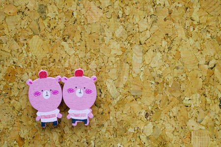 two pig shape magnets and a cork bulletin boardの写真素材