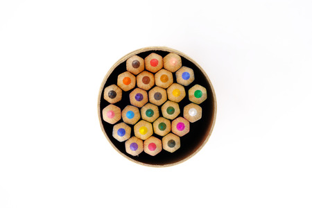 colored pencils in bundle on white backgroundの写真素材