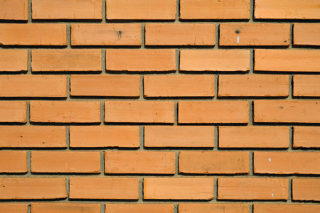 a surface texture of an orange brick wall