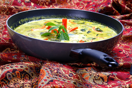 Ingredients for making famous Thai Green Curry with Chicken dish include, red and green chilli, holy basil leaves, kaffir lime leaves, turkey berry, and eggplantの写真素材