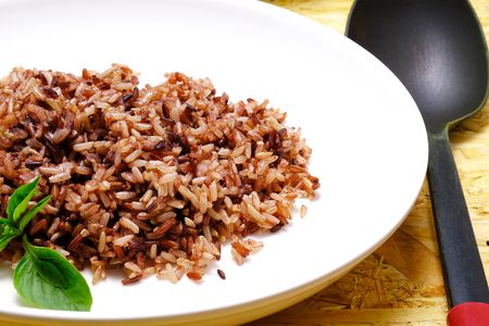 organic cooked rice on a white plateの写真素材