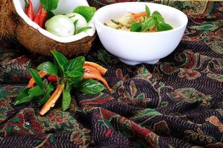 Ingredients for making famous Thai Green Curry with Chicken dish include, red and green chili, holy basil leaves, kaffir lime leaves, turkey berry, and eggplantの写真素材